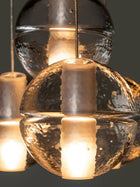 Bocci 14.4 Geometric taklampe nærbilde av klart glass med lys