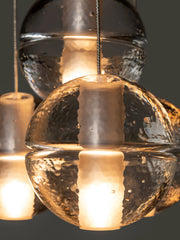 Bocci 14.4 Geometric taklampe nærbilde av klart glass med lys