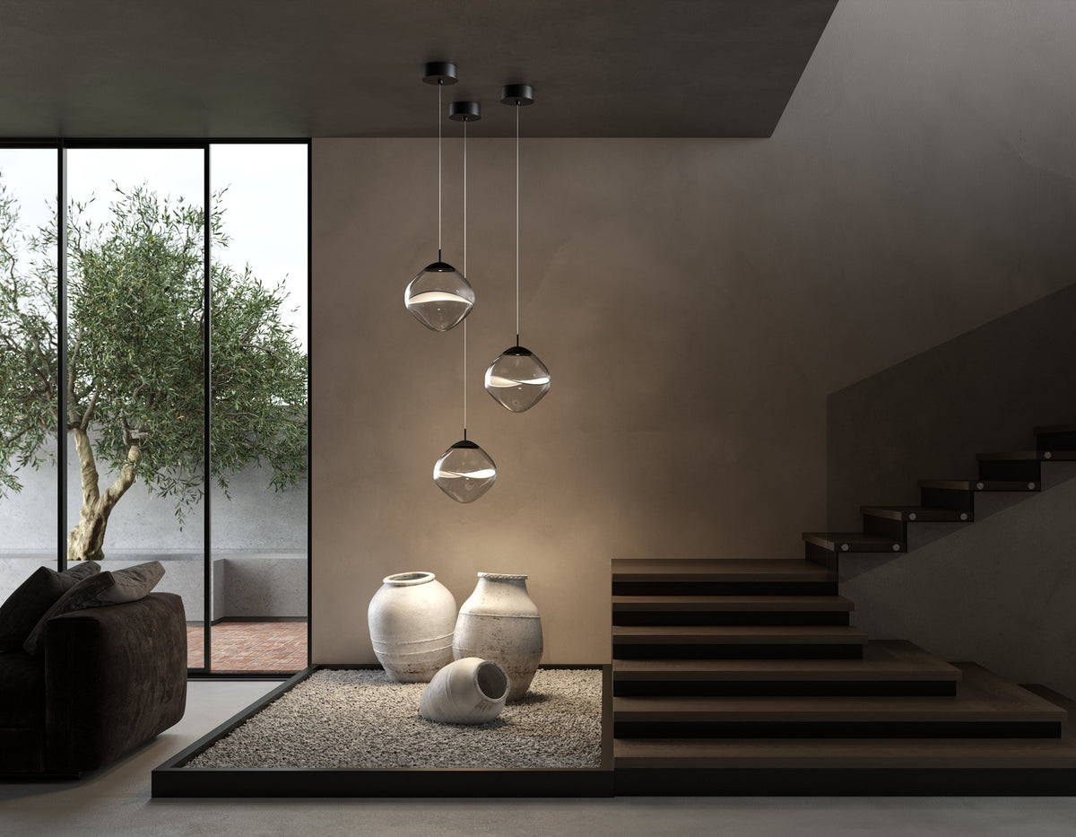 Lumina lampe i mykt design av glass og tekstil 